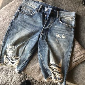 Distressed knee length jean shorts